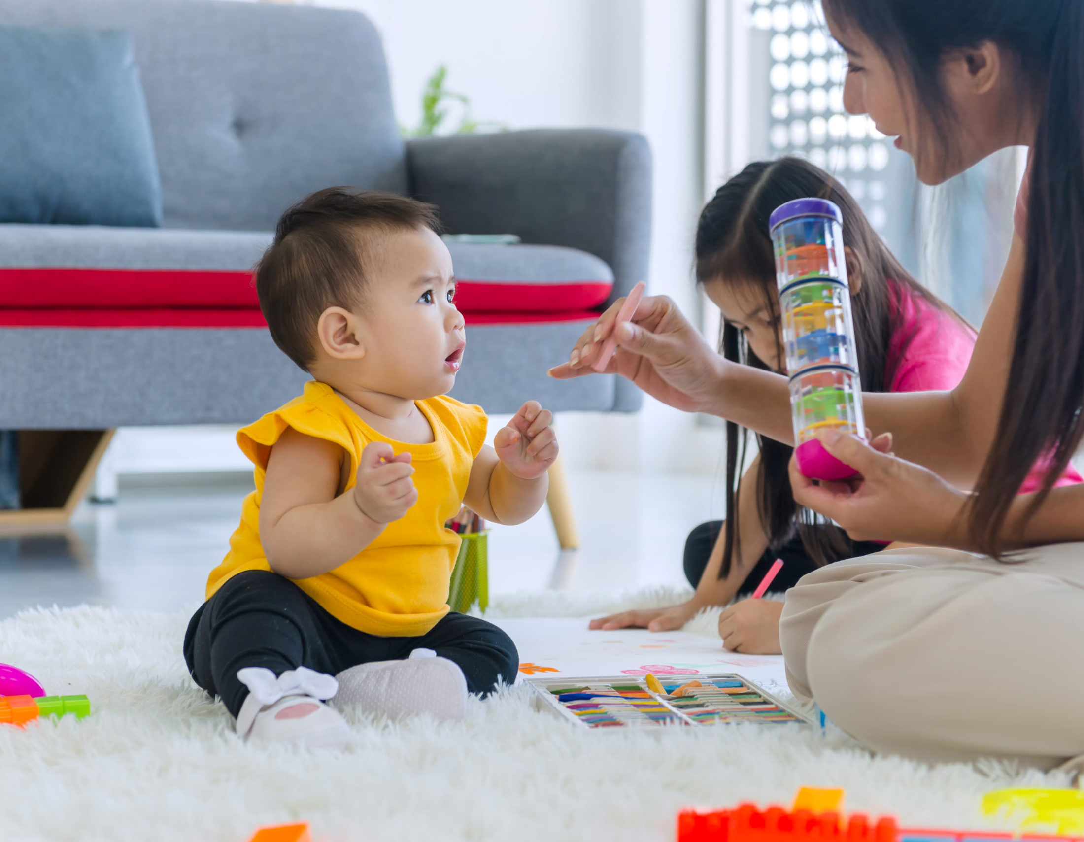 On the holiday, the young mother and daughter And the eldest daughter Playing in the bedroom, drawing, doing yoga, exercising and playing toys on the bed, Asian family Thailand,